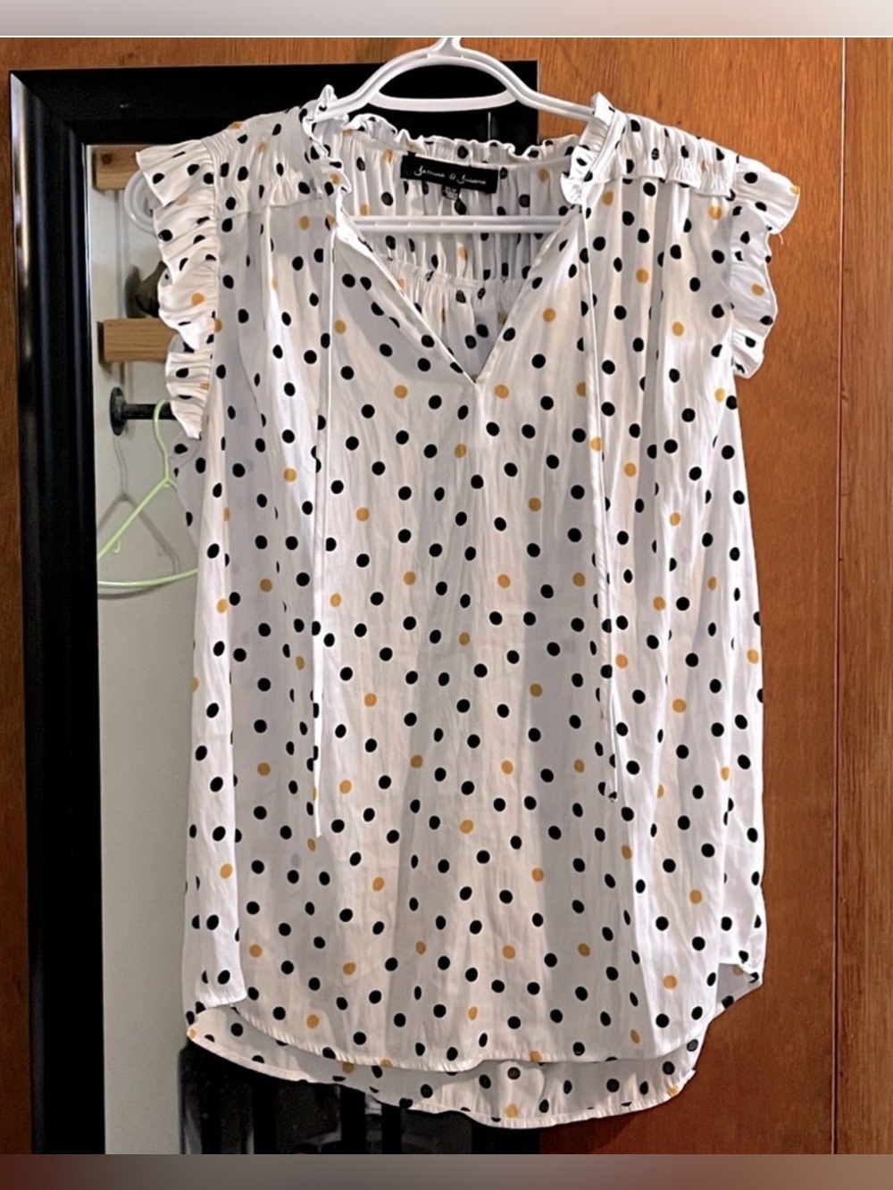 Jasmine & Juliana blouse with a polka dot pattern and ruffle flutter sleeves.